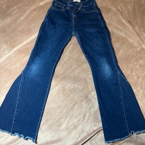 Girl's dark wash flare jeans with a frayed hem. Stretchy, Size 12 youth